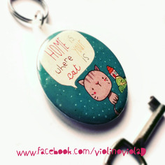 Portachiavi rotondo illustrato. home is where your cat is 